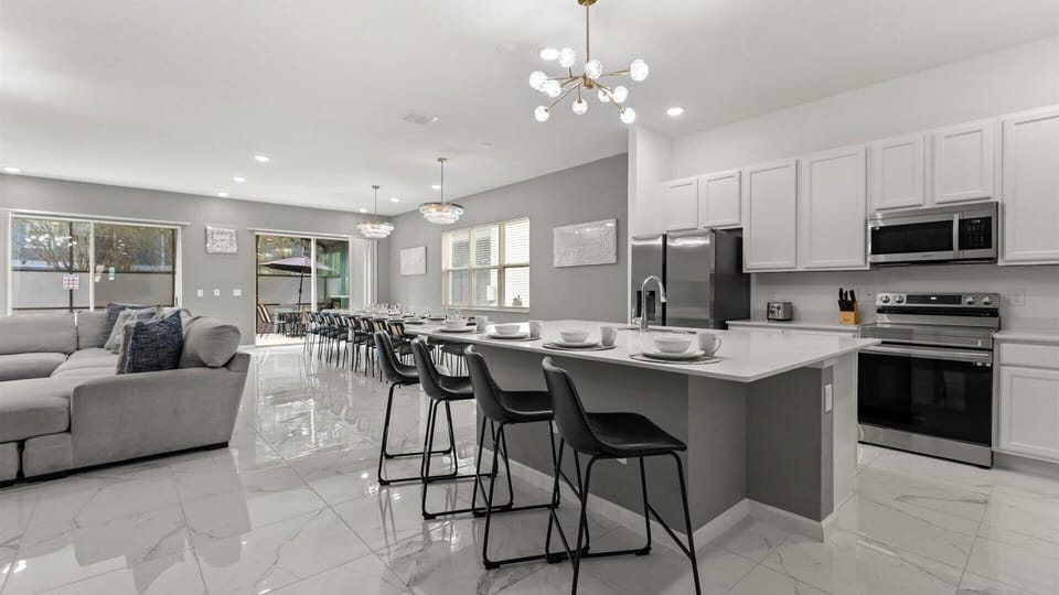 Kitchen: Fully equipped modern kitchen with stainless steel appliances, ample counter space, and everything you need for home-cooked meals.