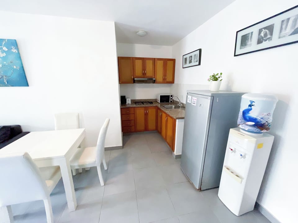 Executive Suite, Garden View | Private kitchen | Fridge, stovetop, coffee/tea maker, cookware/dishes/utensils
