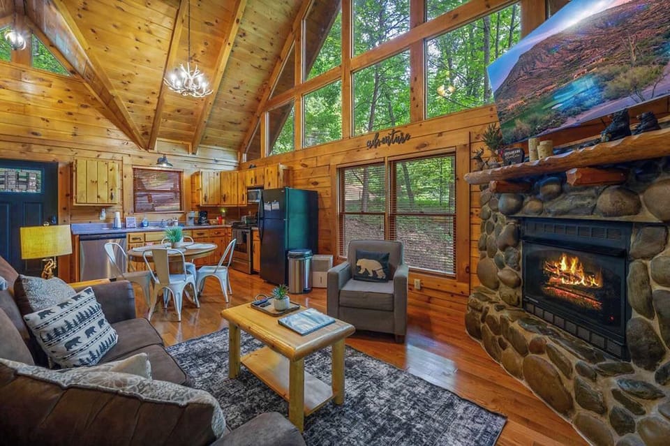 Open concept living: Fireplace, forest views, and a great kitchen!