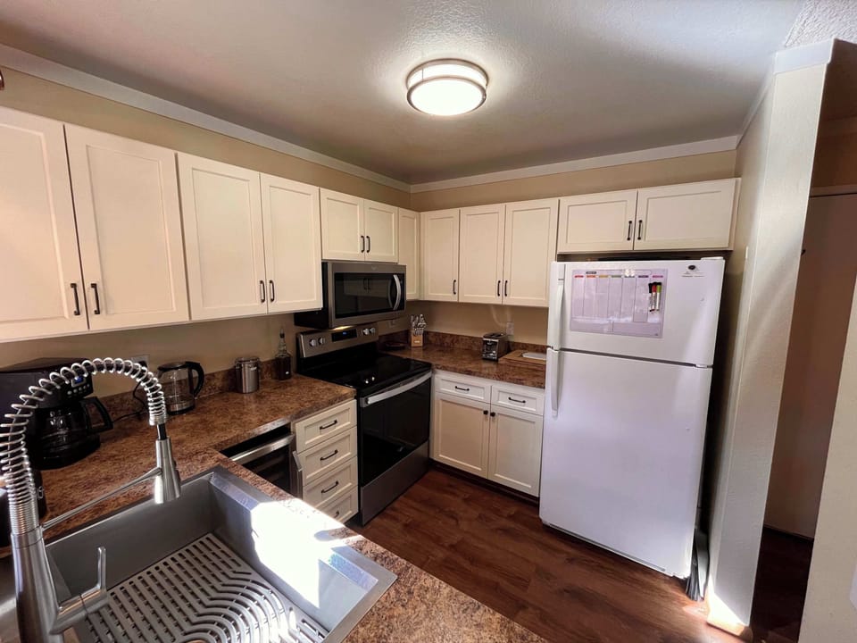Fully stocked kitchen with upgraded appliances.