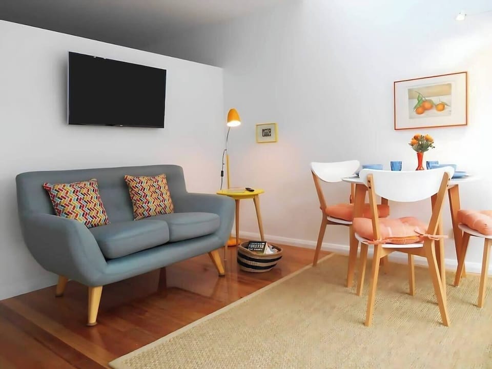 The cheery living and dining area offers a double sofabed and table to sit back and relax with a meal or a spot of TV