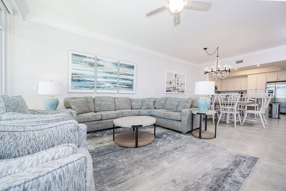 Gather in this welcoming living space and enjoy stunning beach views through the windows