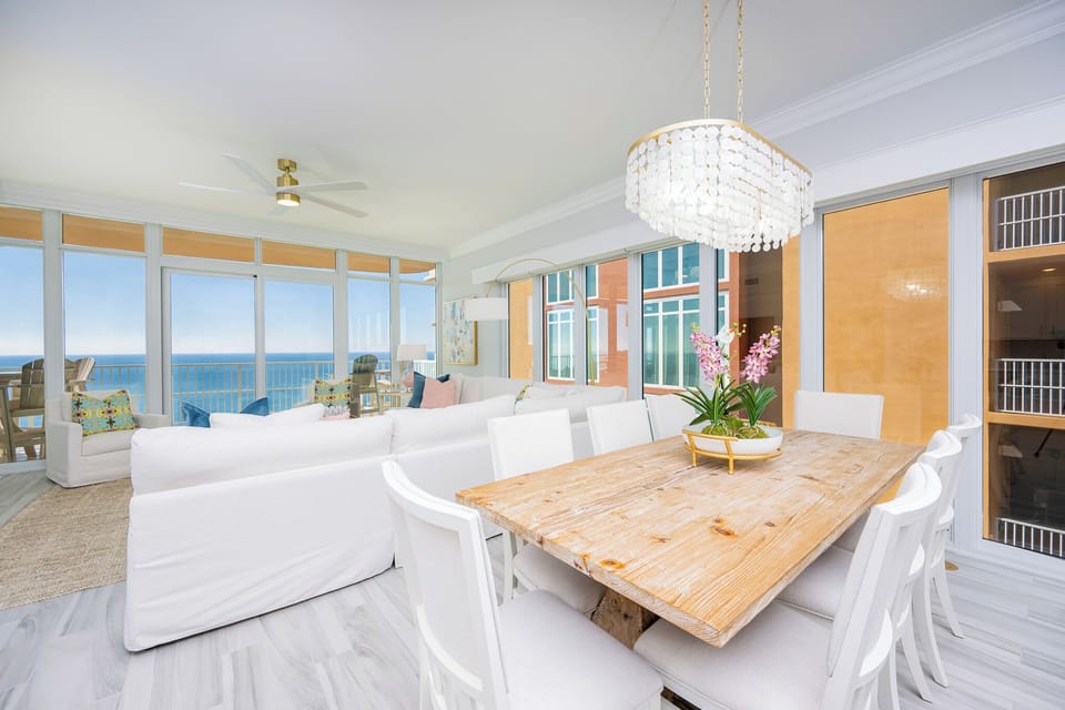 Sink into the sofa and gaze at the coast beyond through floor-to-ceiling windows