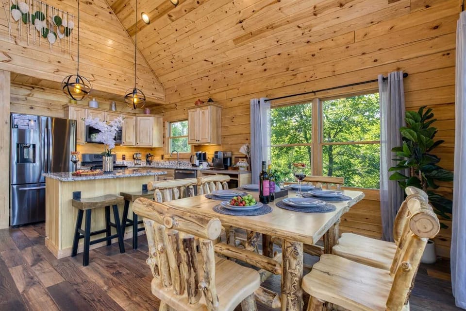 Bright dining and kitchen space showcasing the heart of the cabin—designed to keep everyone together while cooking, eating, and relaxing.