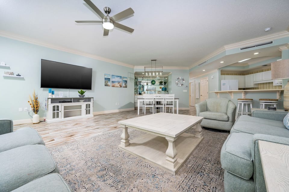 Relax on the cozy sofa with a queen sleeper in this inviting family room with beautiful balcony views