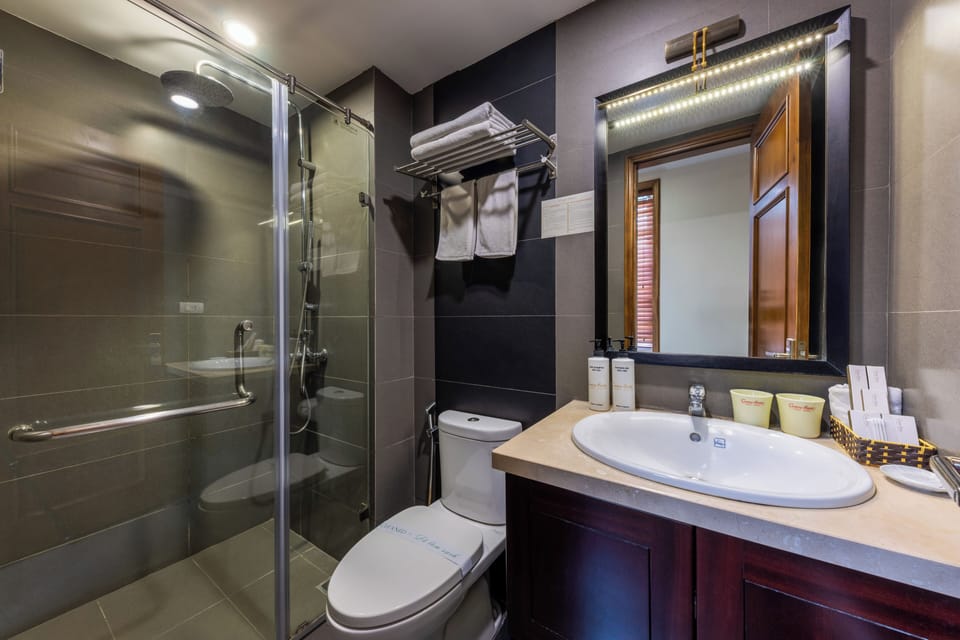Shower, rainfall showerhead, designer toiletries, hair dryer