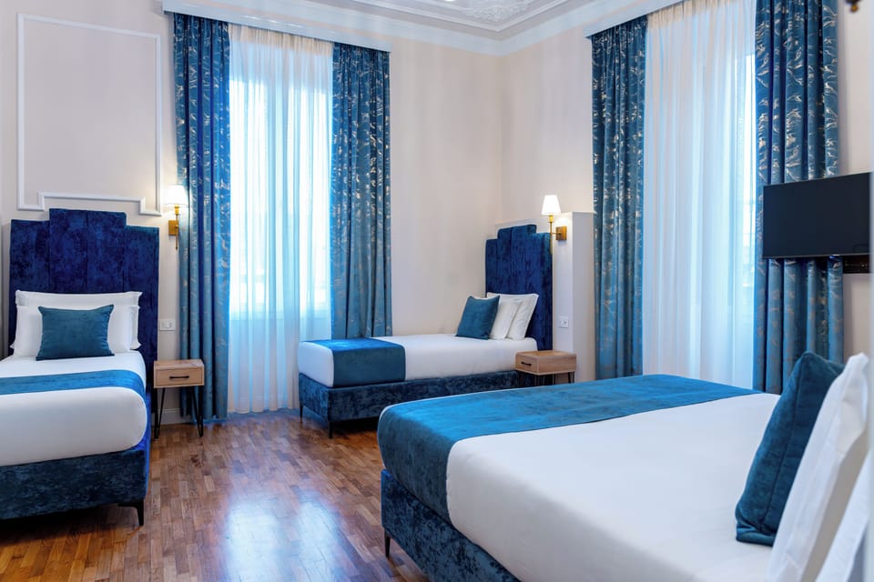 Comfort Quadruple Room | Down comforters, memory foam beds, minibar, in-room safe