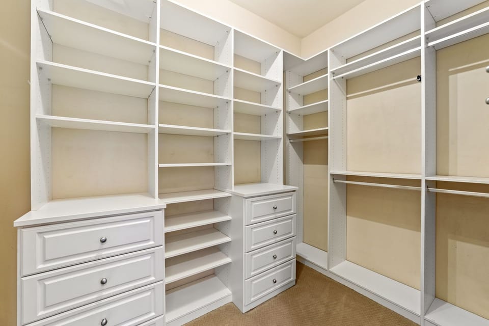 Organized laundry area with ample counter space.