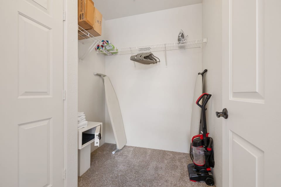 Laundry room with washer and vacuum