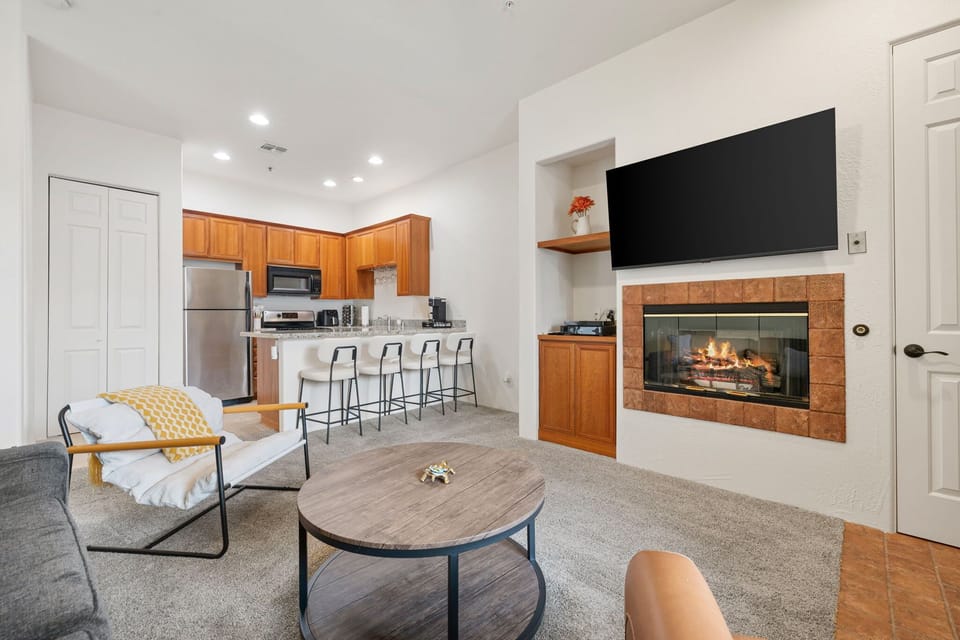 Cozy living room with fireplace and smart TV