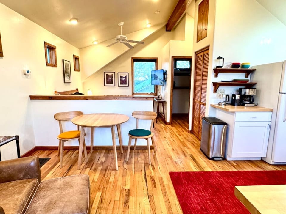 The living and dining area are set up for multiple uses.