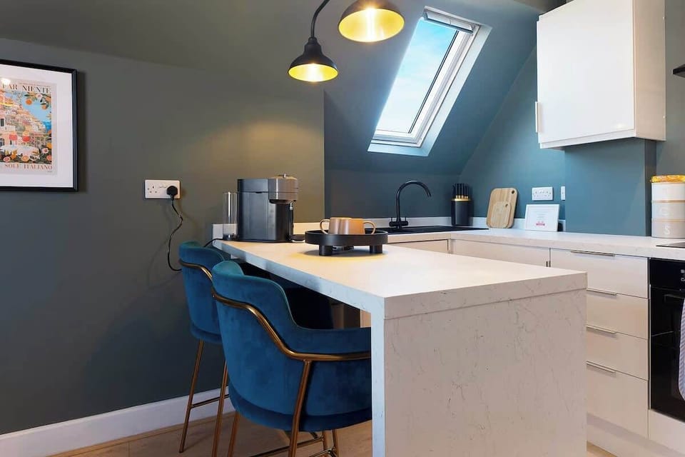 The kitchen comes well-equipped with an oven, fridge, and full cookware set, providing everything you need to prepare meals with ease and comfort.