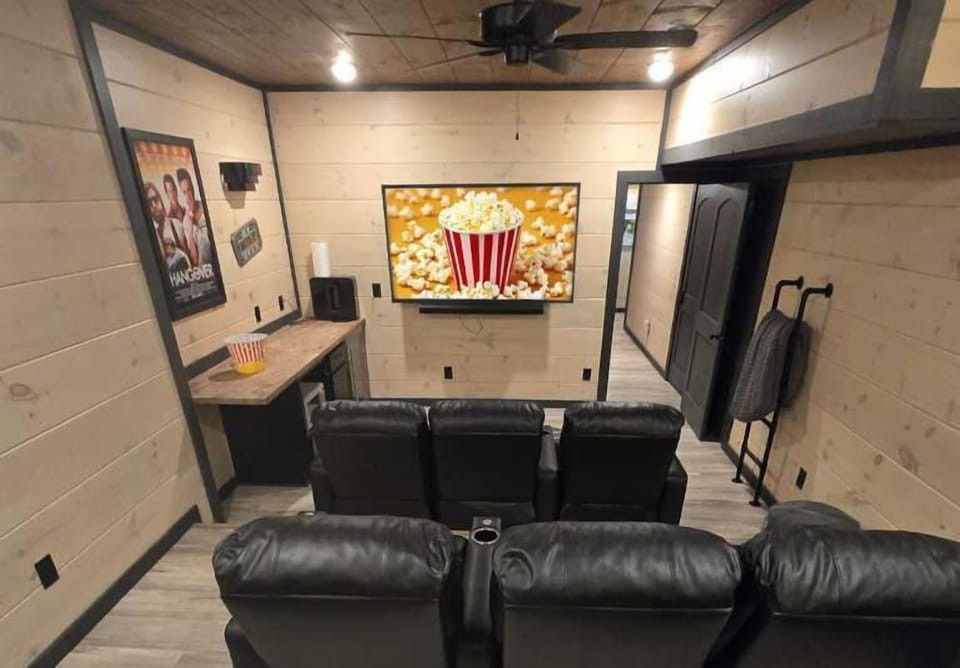 Enjoy movie nights in stylish comfort with plush seating and a big-screen experience!