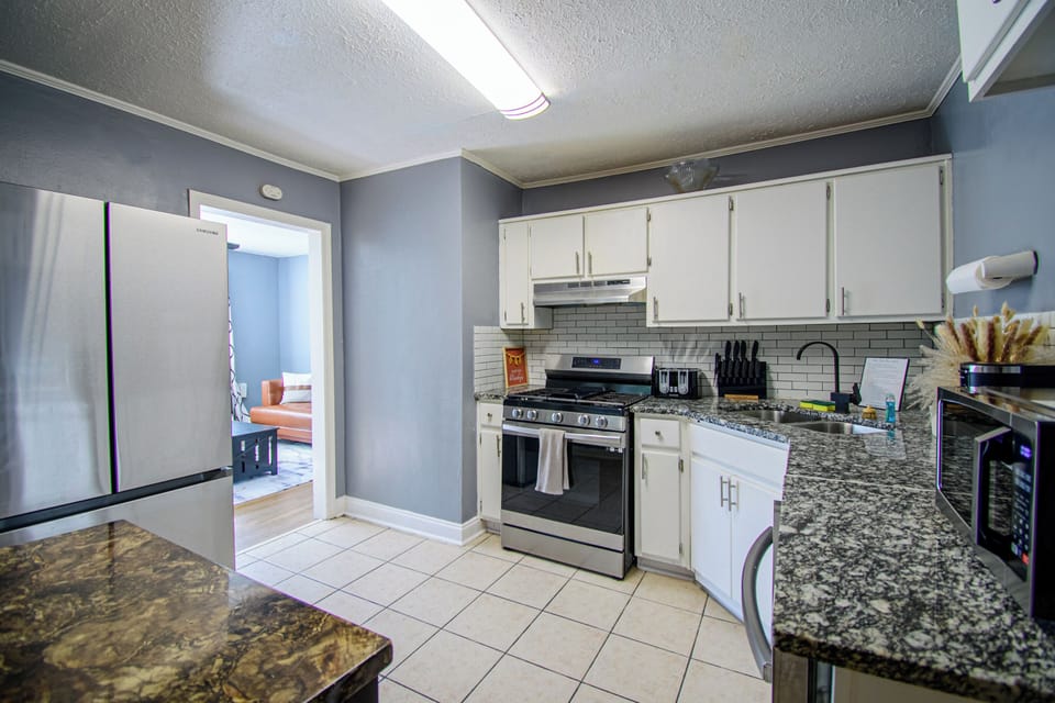 Fully equipped kitchen with new Samsung appliances.