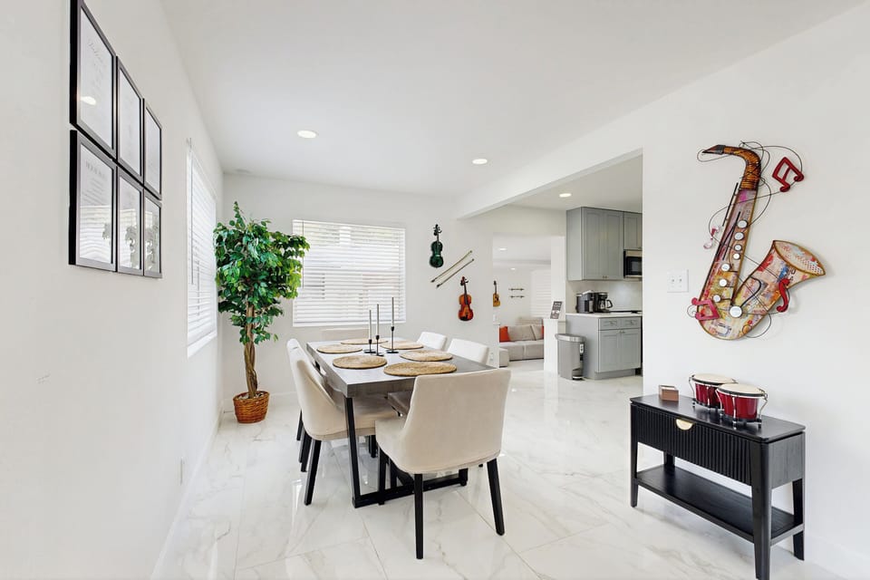 Bright kitchen and dining area with full-size appliances and a cozy table perfect for meals or morning coffee.