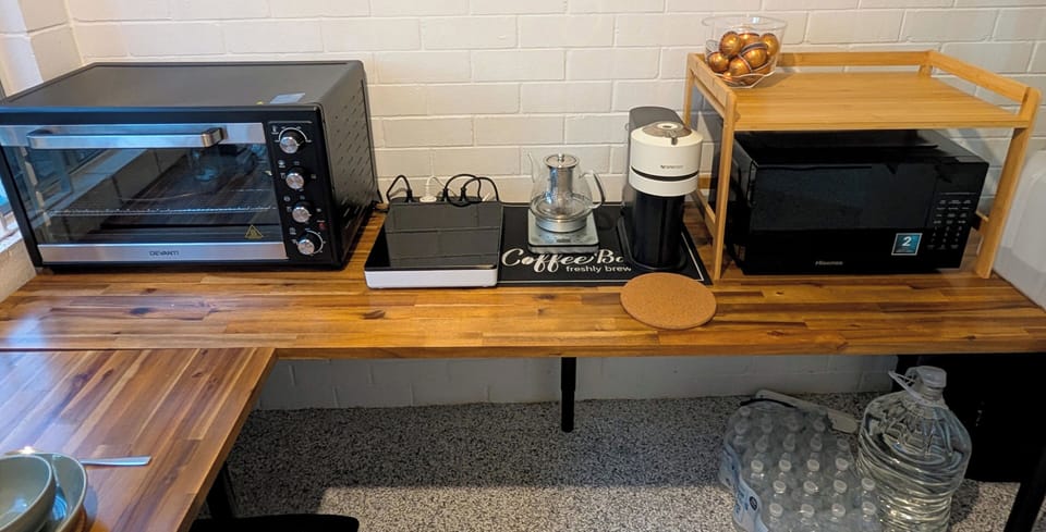 oven, microwave, induction stove, coffee machine, tea brewer