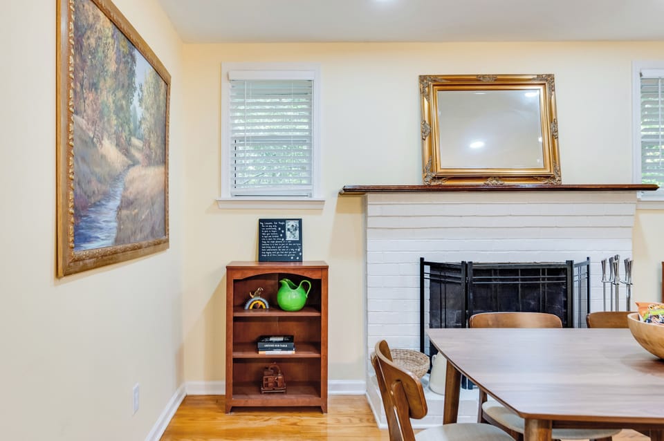 Dining Area: Bright and inviting space with artful decor and a lovely view for memorable meals!