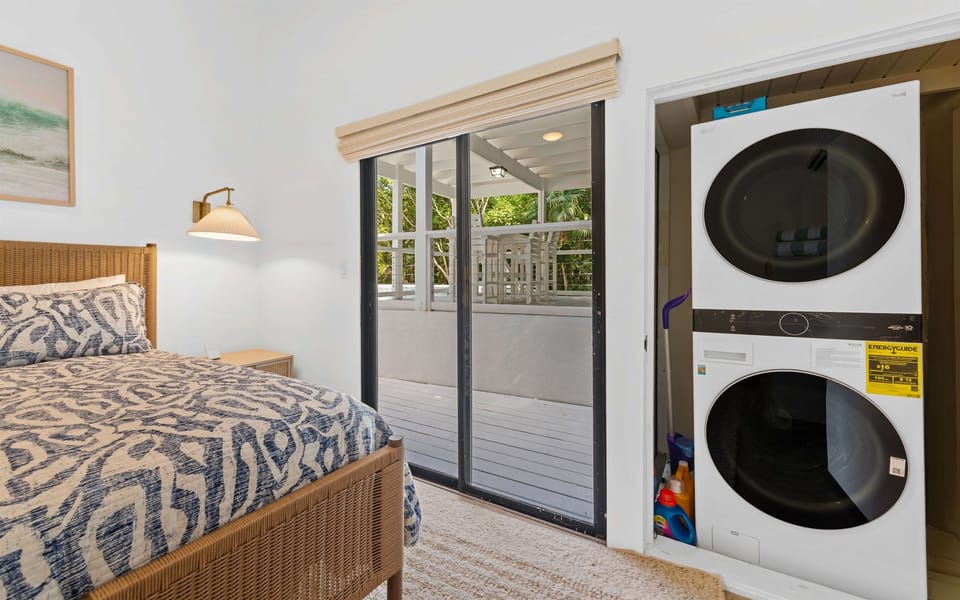 Washer and dryer in the closet of the guest bedroom for the convenience of the whole family