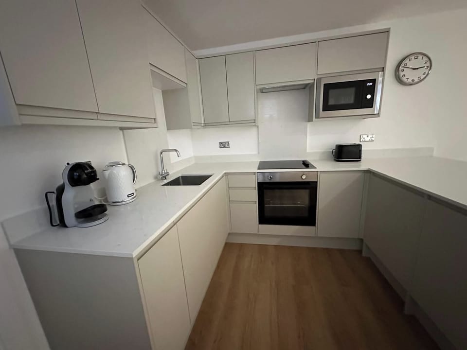 New fitted kitchen with fridge, freezer, microwave & dishwasher 
