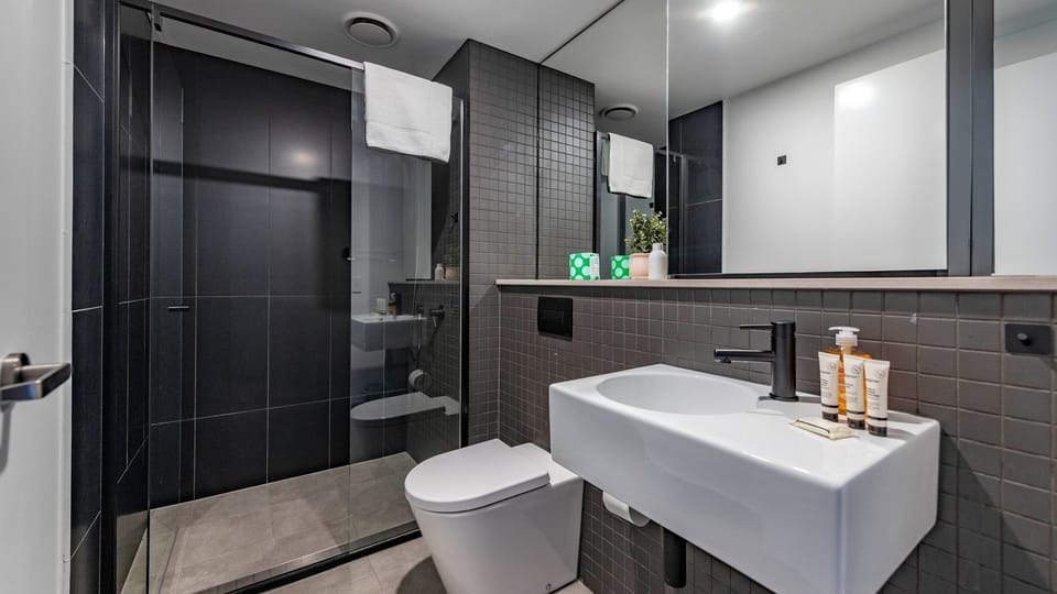 Contemporary ensuite featuring premium finishes and walk-in shower