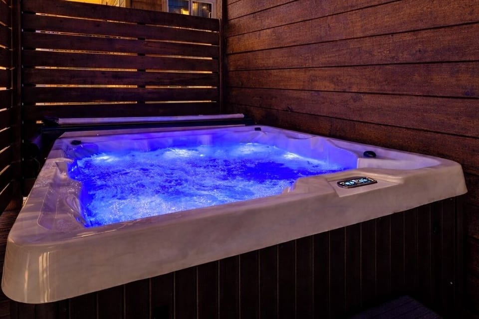 Relax in your private covered hot tub any time