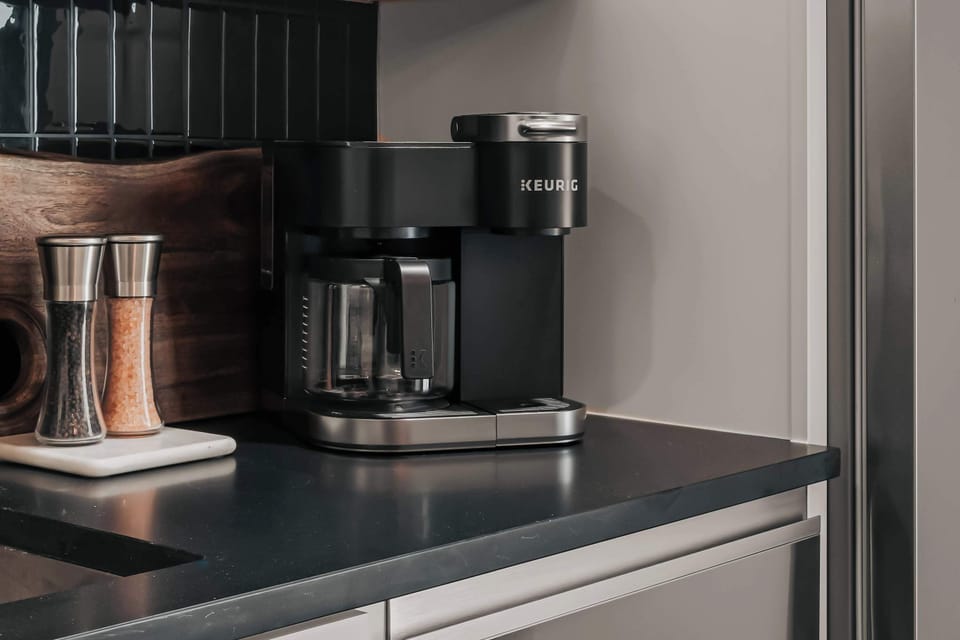 The Highball - Coffee lovers will appreciate the Keurig Duo, offering the flexibility to brew both K-Cups and fresh local ground coffee—both of which are thoughtfully provided for your stay.