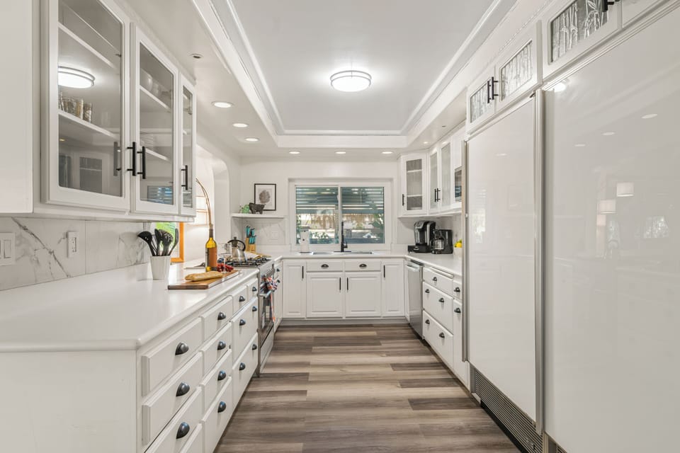 A fully equipped kitchen area with ample counter space for meal preparation.