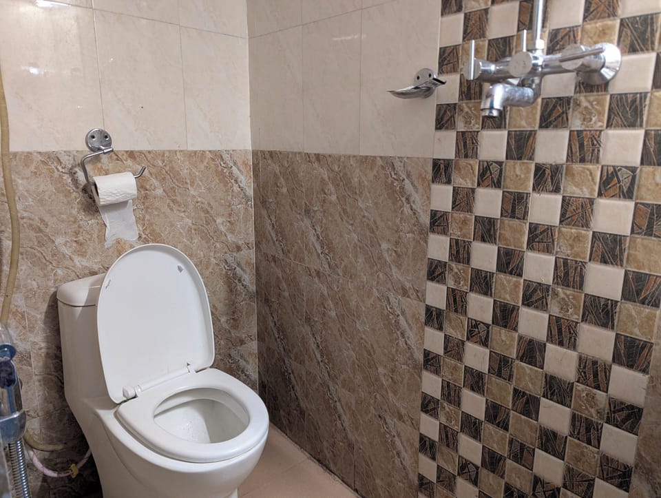 Shower, slippers, towels, soap