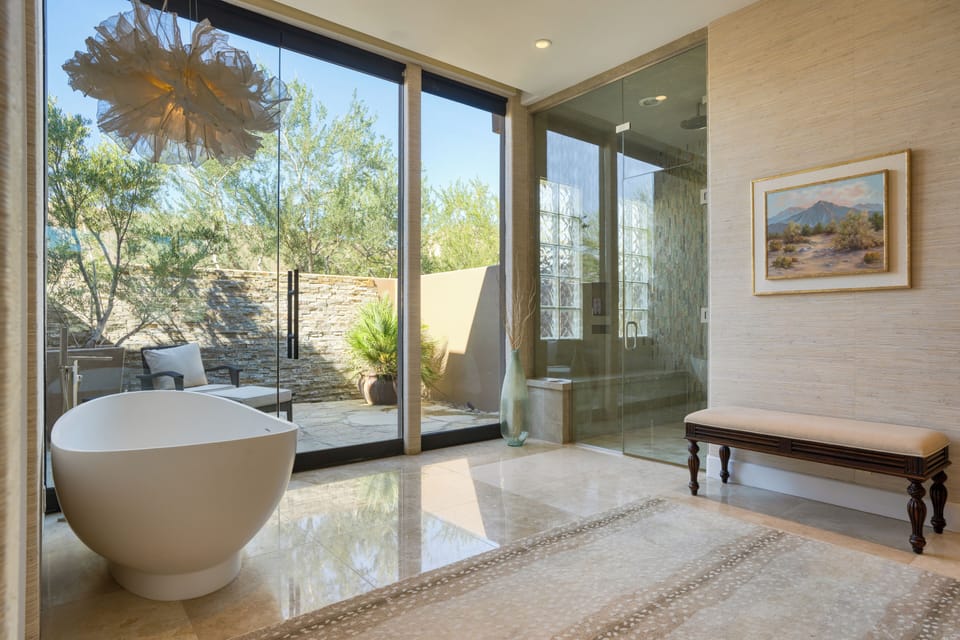 The primary bedroom's ensuite features a shower and a soaking tub.