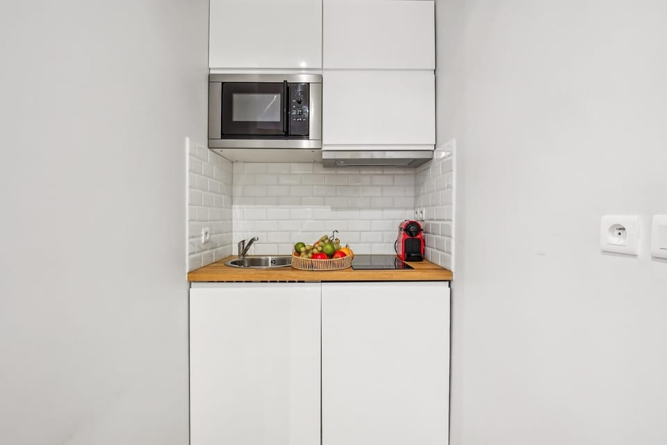 The kitchen is fully equipped to prepare a simple meal 