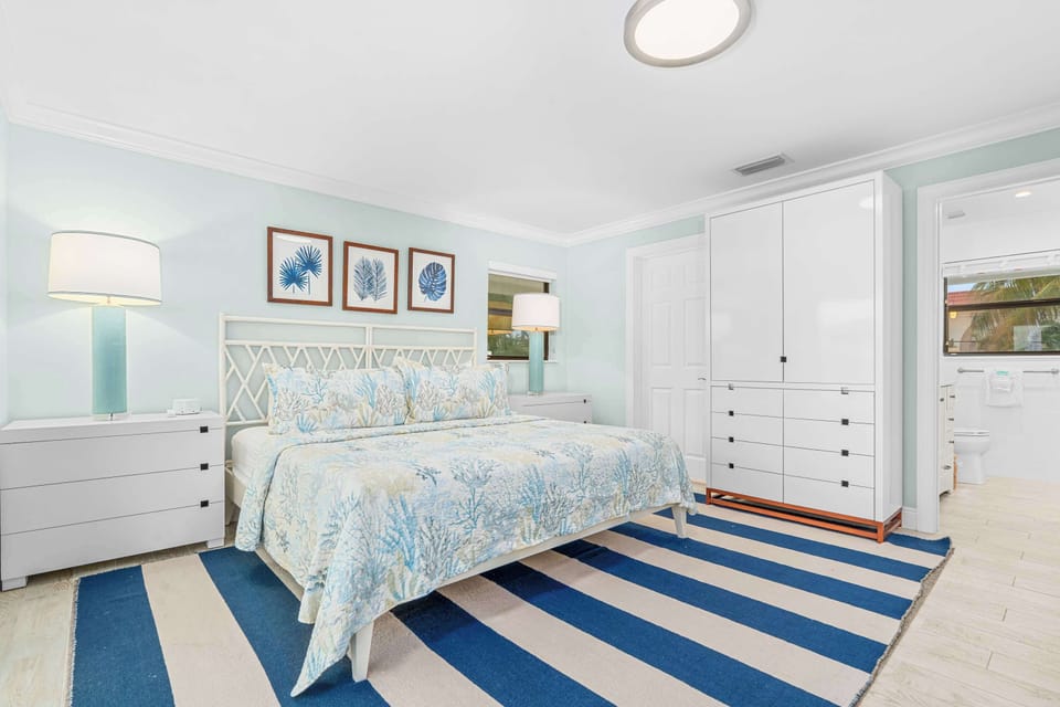 Primary king bedroom with plenty of space, natural light and a calm coastal feel.