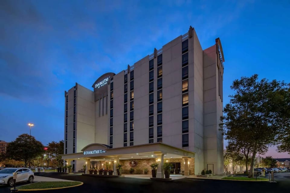 Evening view of DoubleTree building with lights on