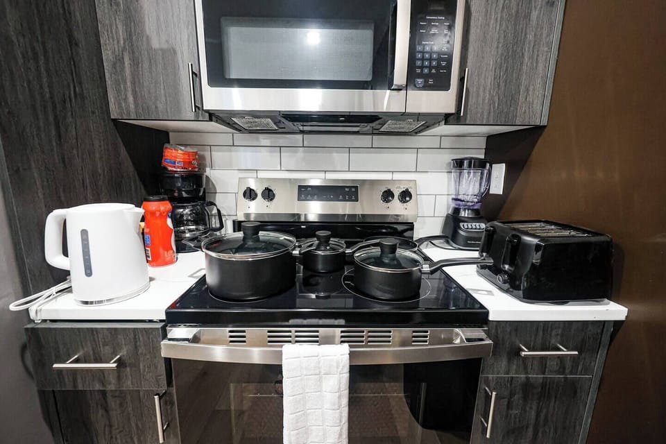 Kitchen essentials pots and pan are provided 