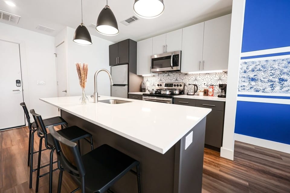 Our open-concept kitchen seamlessly blends with the living space, enhancing its modern appeal and functionality.