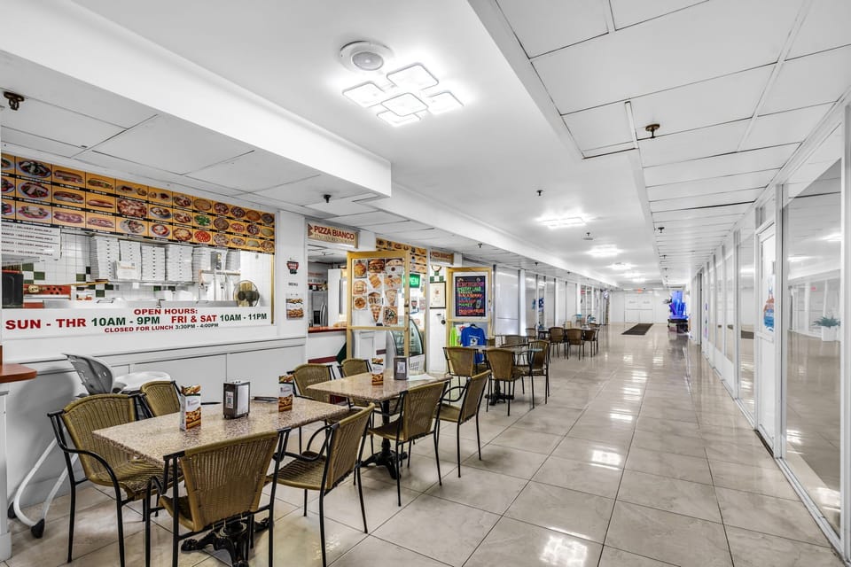 "Enjoy casual bites in this charming indoor café—ideal for quick meals, coffee breaks, or catching up with friends in a relaxed setting!"