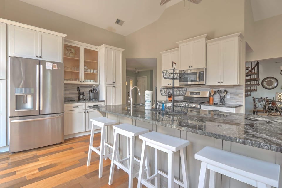 Well appointed kitchen with granite counters and stainless appliances