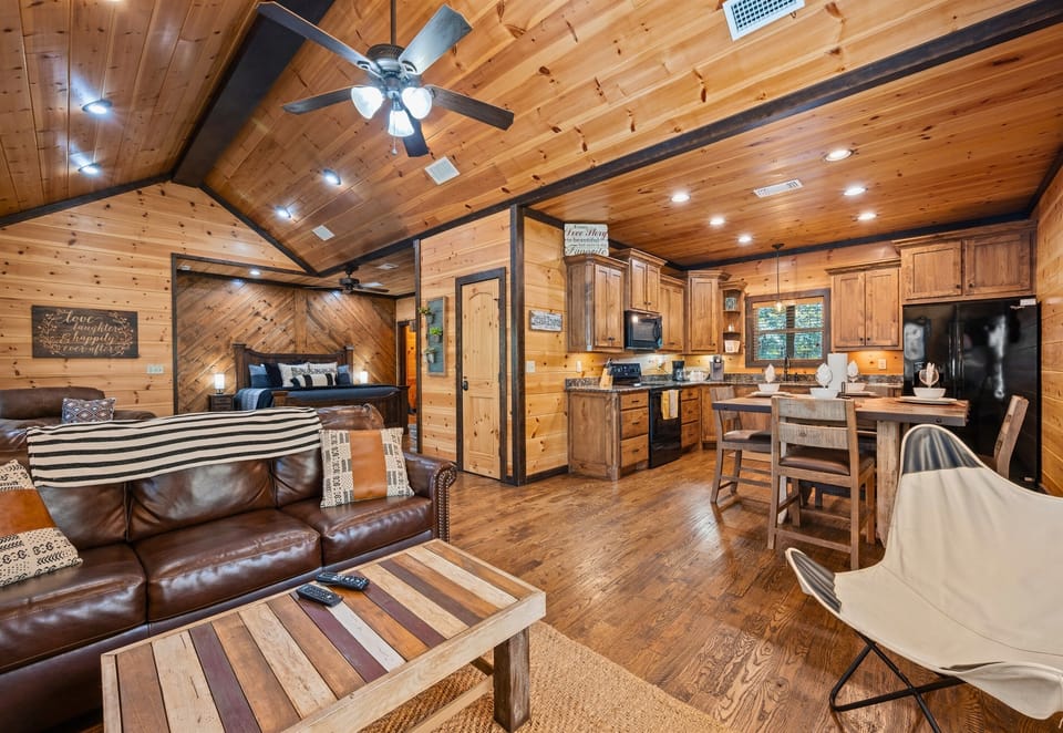 Open-concept layout with vaulted ceilings and warm lighting.