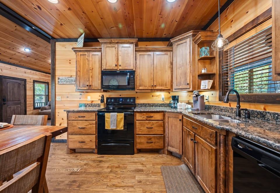 Beautiful kitchen with plenty of counter space and cabin-style cabinetry.