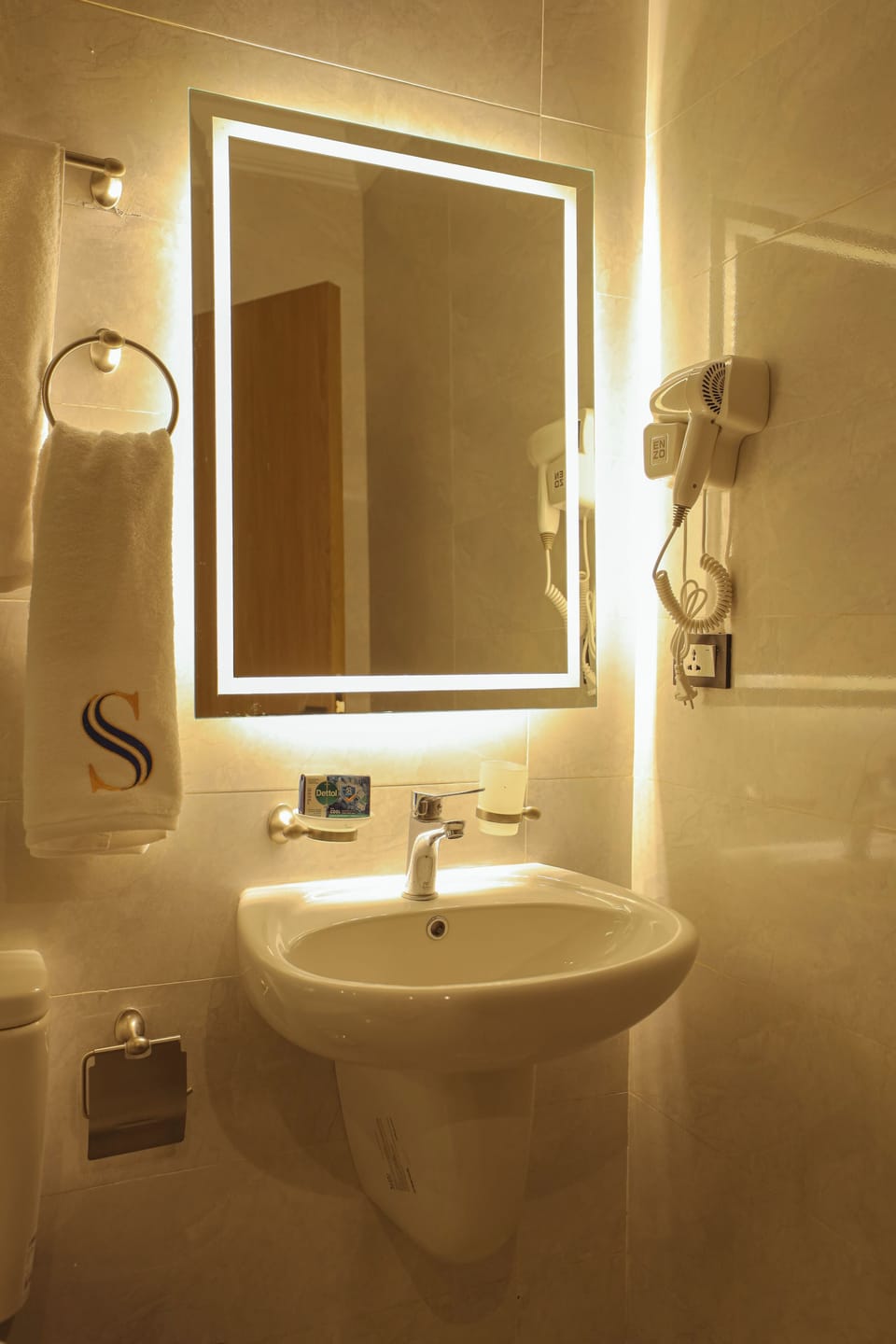 Hair dryer, slippers, towels, soap