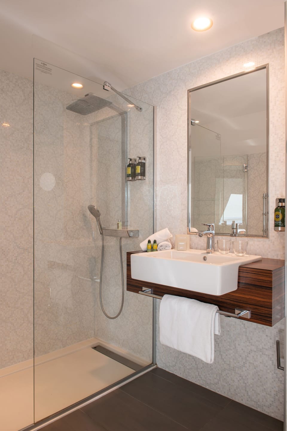 Shower, designer toiletries, hair dryer, towels