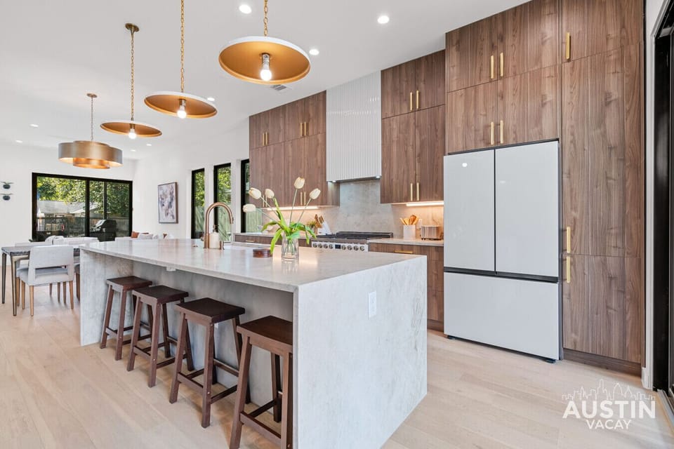 Custom walnut, Taj Mahal stone—this kitchen doesn’t do average.