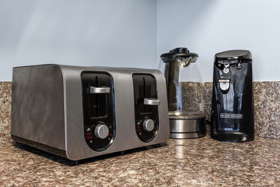 Stainless toaster and coffee maker ready for your morning beach brew.
