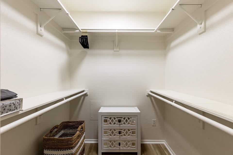 Spacious walk-in closet with ample storage and organization
