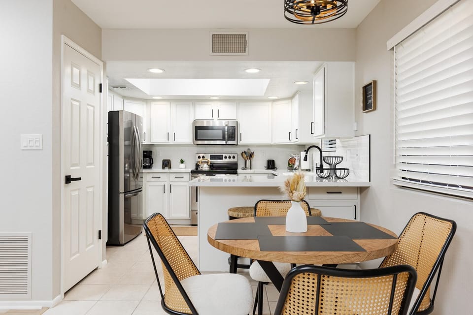 Bright, modern kitchen and dining area with sleek finishes