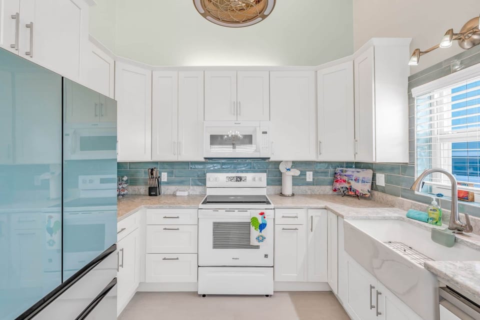 Kitchen area, fridge oven, microwave and dishwasher