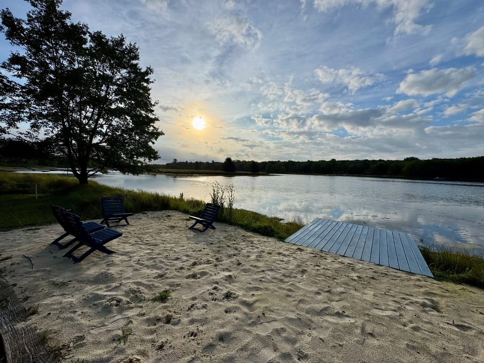 Private beach and dock just steps from the home