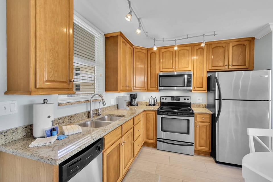 Cookware, dinnerware and many kitchen tools and small appliances are provided for your use, including a Keurig and drip-style coffee maker.