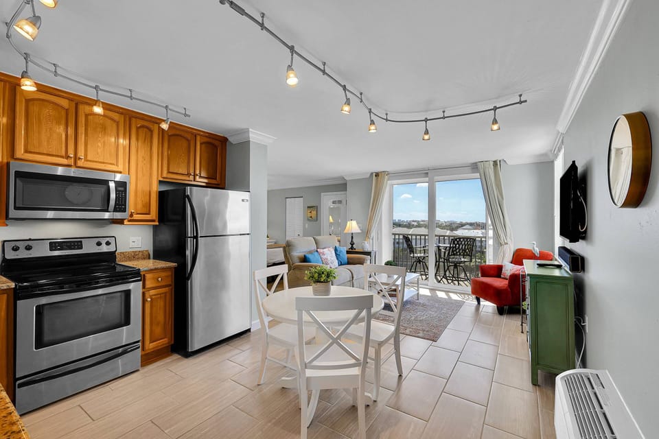 The studio combines living, dining, kitchen and bedroom space in one open concept.