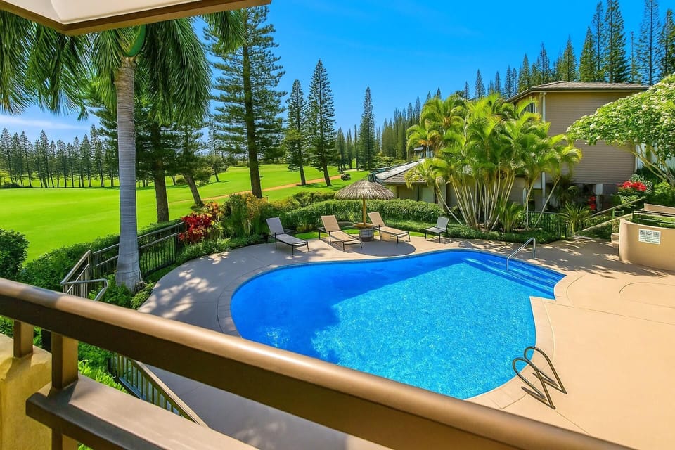 Your resort-pool and tropical-green view sets the tone for splashy mornings and chilled sunset lounging KGV-14T6