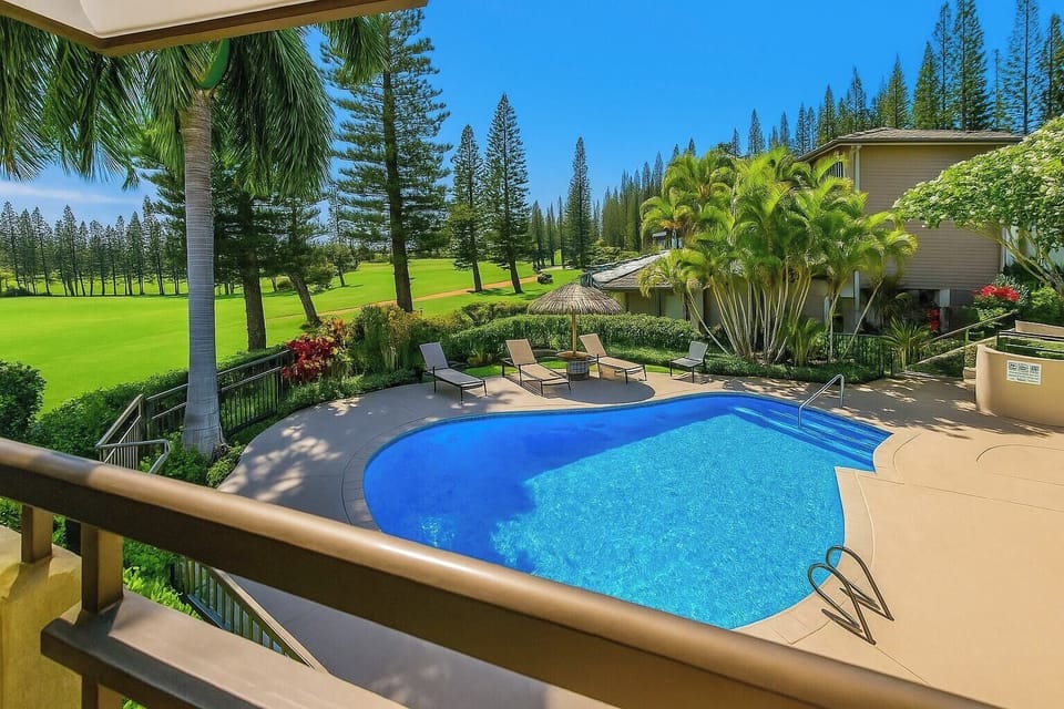 Your resort-pool and tropical-green view sets the tone for splashy mornings and chilled sunset lounging KGV-14T6